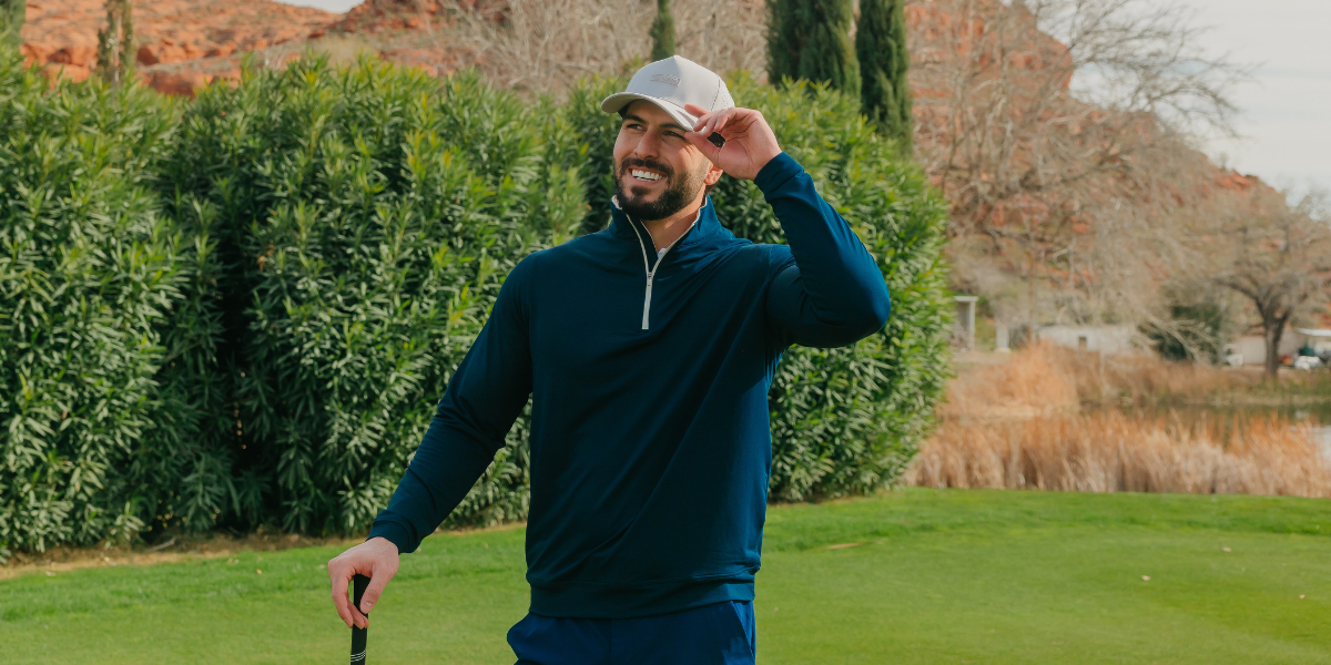 Man zipping up stylish gray mens 1/4 zip pullover 