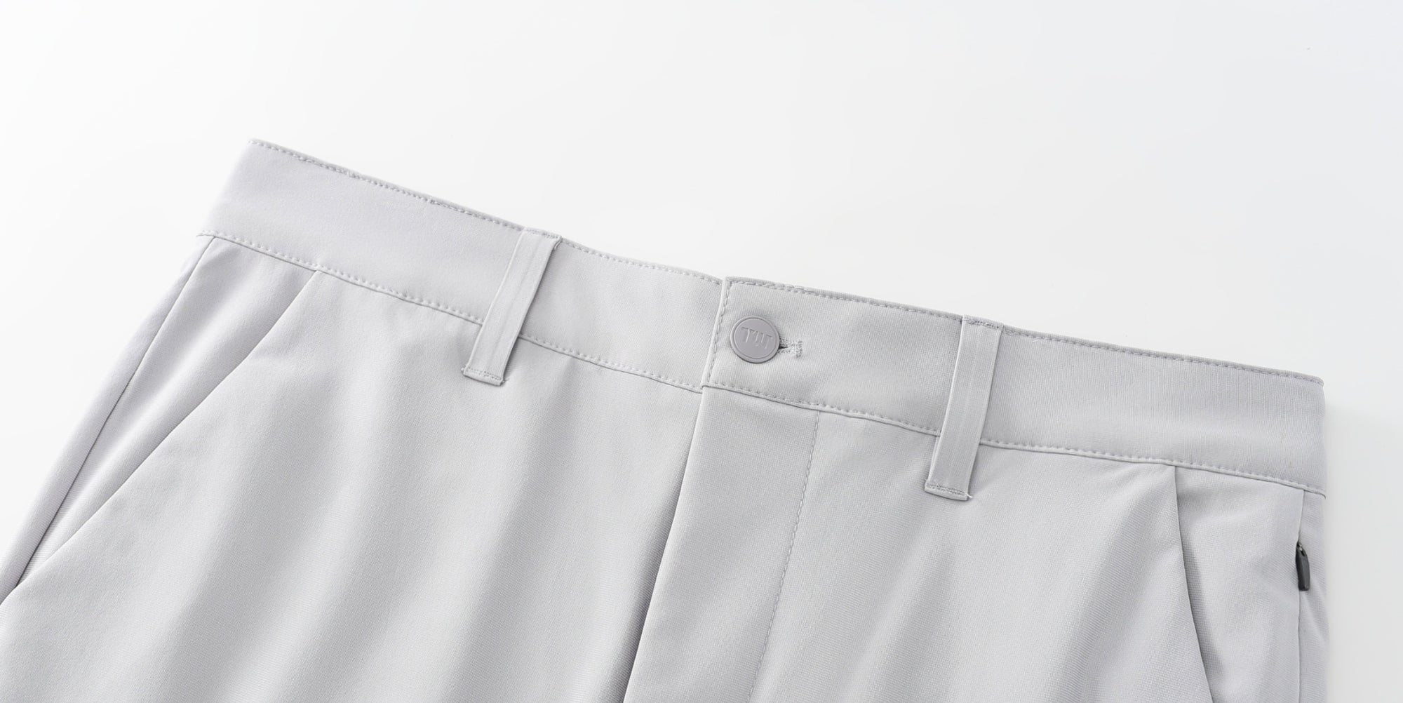 Man pouring juice on Truwear moisture-wicking dress pants