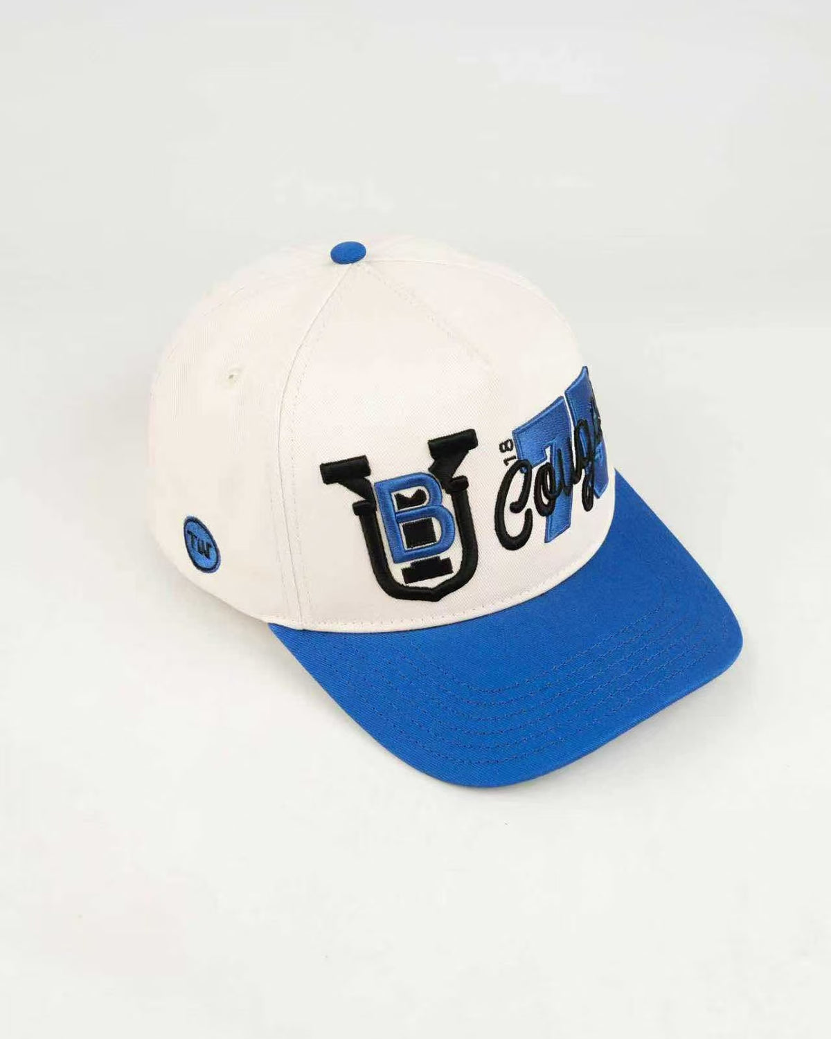 BYU Fade Hat Natural Royal Brim 2 Logo BYU – angled view